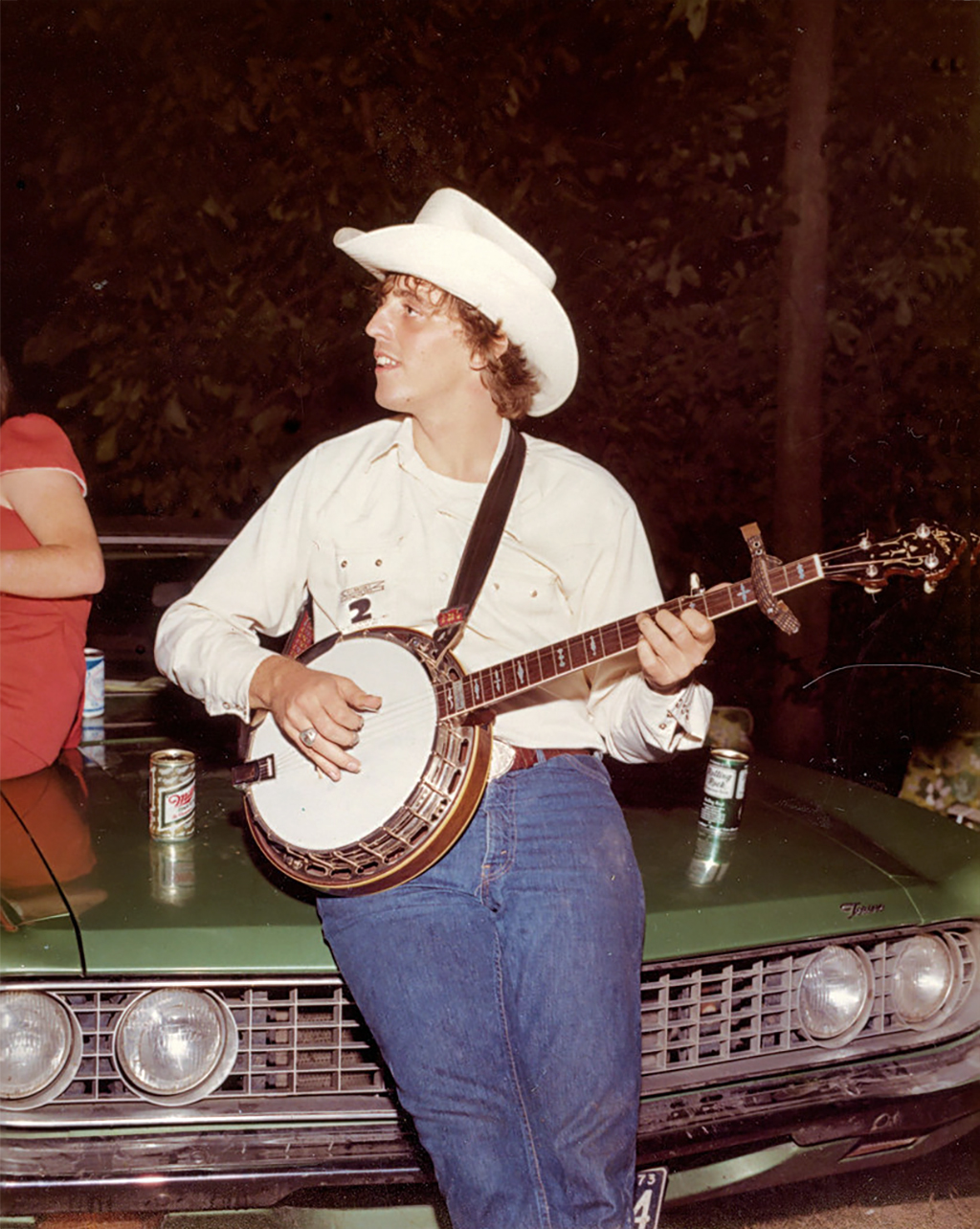 Gary McMullen playing banjo, 1970s. Copyright Wayne T. Helfrich